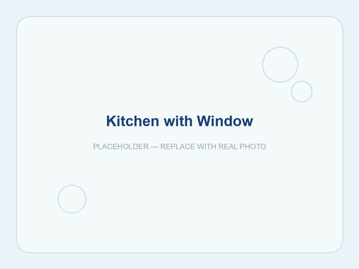 Clean kitchen with a sunlit window