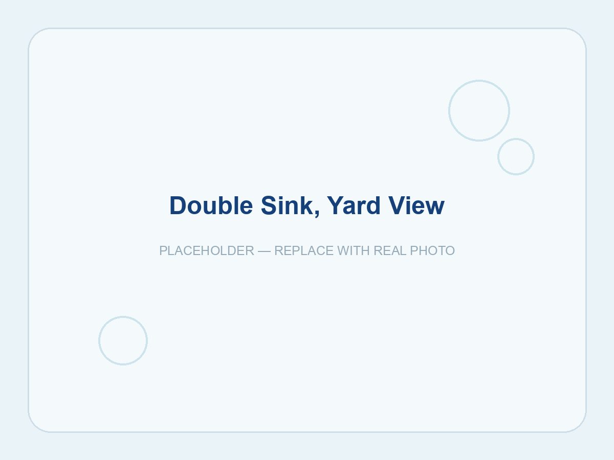 Polished double sink overlooking the yard